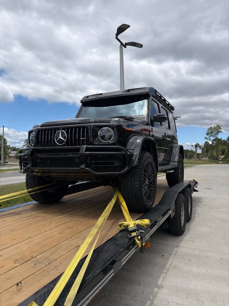 Mercedes-AMG G 63 4x4 Squared loaded on a dedicated single-car hauler for transport