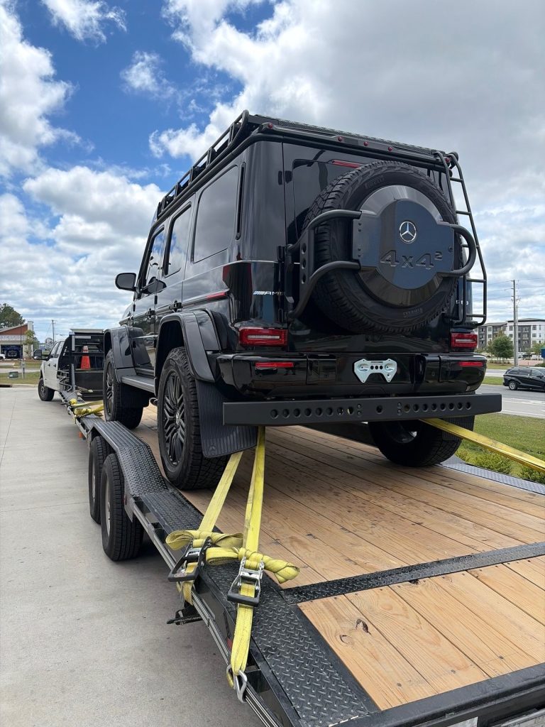Rear view of Mercedes-AMG G 63 4x4 Squared secured for specialty auto transport